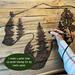 This shows me drawing the bear wall art using pyrography tools or wood-burning technqiues. I am drawing on a pallet up up-cycled fencing. 